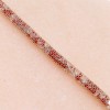 Bracelet in "sock" design with many small white and red zircons, gold plated, 2999.